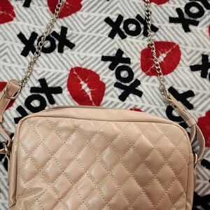 Light pink cross body purse. Adjustable strap, very clean, maybe used once.